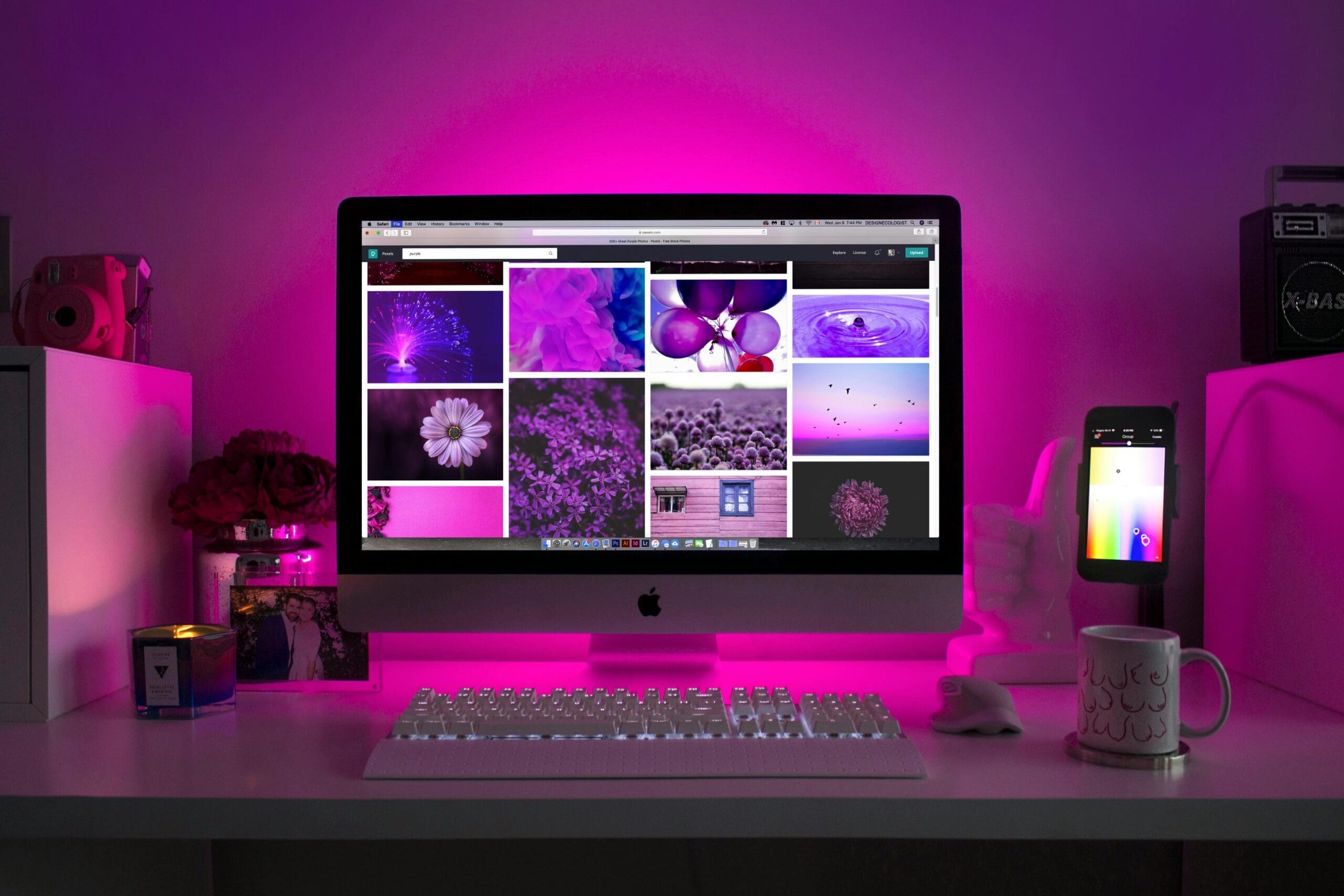 Screen on Modern wall with pink/purple background after Website Redesign Guide From Apex Web